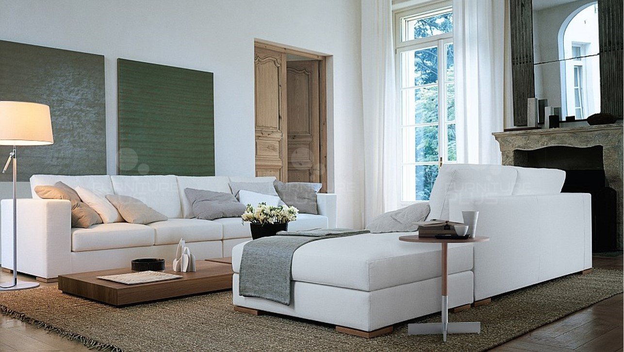Dallas fully upholstered white 4+2+Ottoman sofa set with throw pillows and in a modern living room