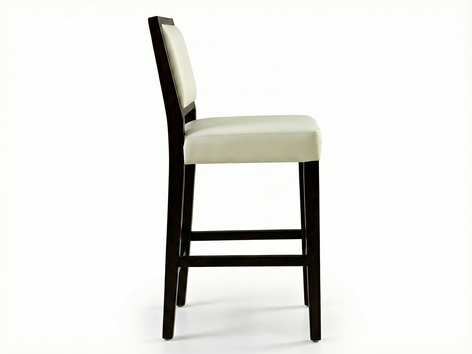 Side view of a high-backed, contemporary Dann bar stool featuring a solid, dark Mahogany wood frame with straight legs. The square seat and rectangular back panel are upholstered in a contrasting smooth, light-colored vinyl or leather