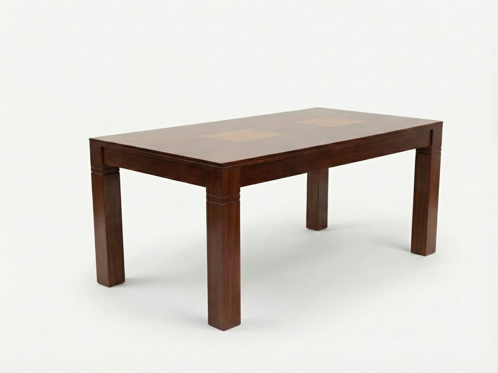 Side view of Jacob dining table with lighter color patch on the table top and solid square legs with a grove pattern made with Mahogany timber