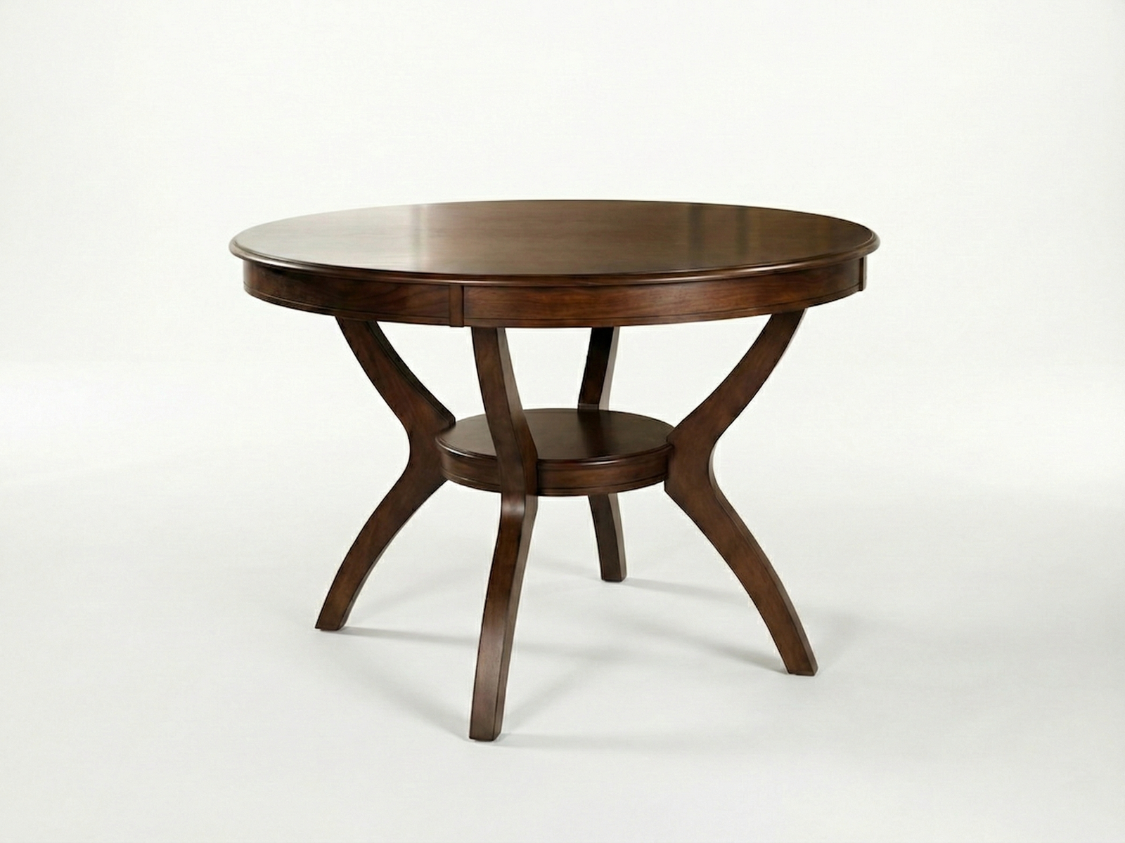Side view of Jayden circular dining table with bottom shelf and curvy legs made out of solid Mahogany timber