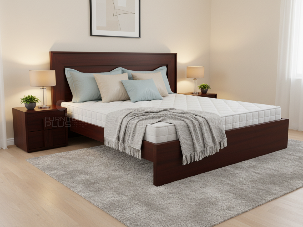 Warm contemporary bedroom with a Patricia dark reddish-brown Mahogany wood platform bed featuring a recessed headboard panel and blue-gray accent pillows