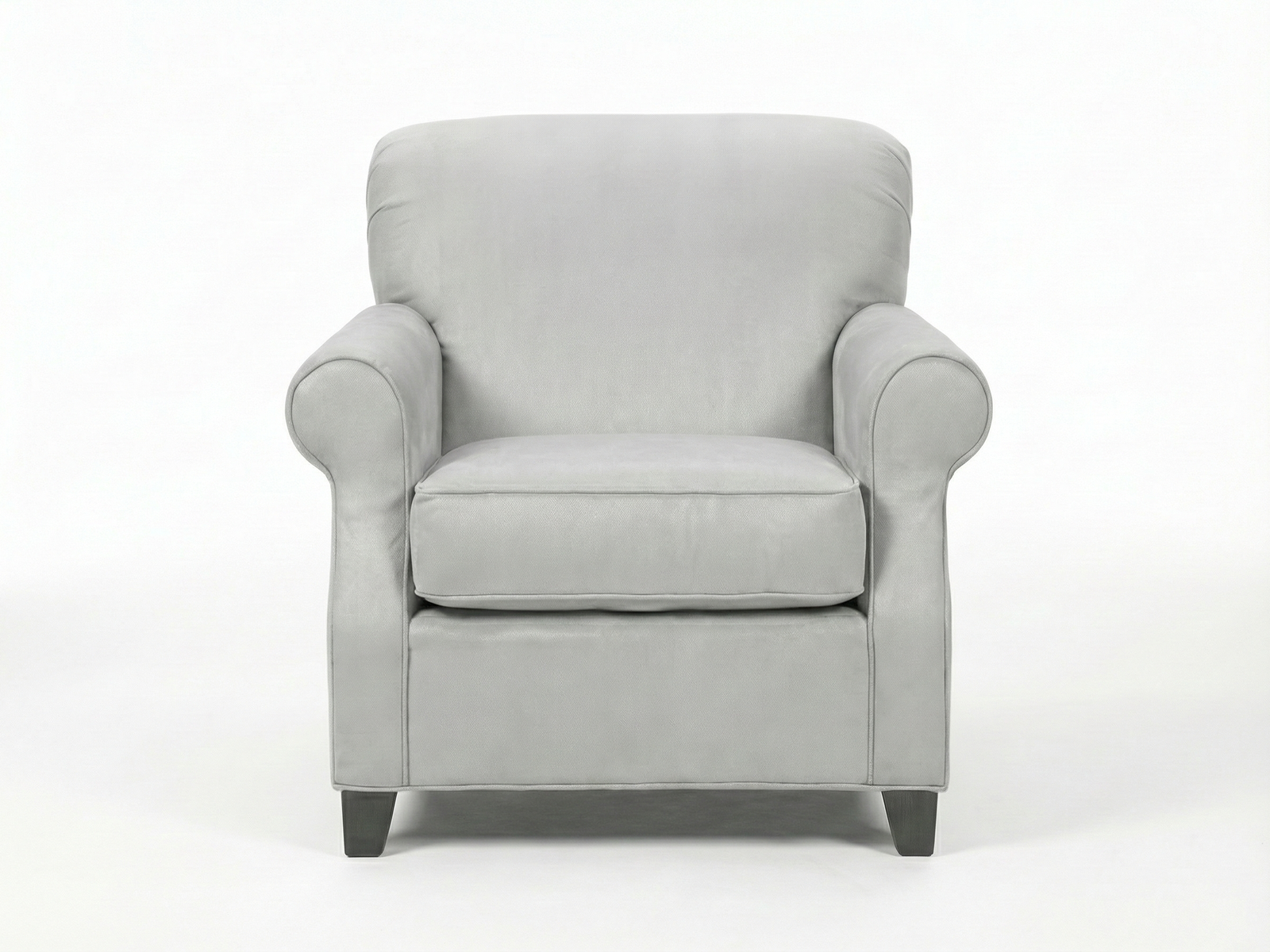 Front view of the Stacy Easy Chair, a traditional-style armchair fully upholstered in light gray fabric or leather. It features a rolled back, classic rolled armrests, and a thick, removable seat cushion with piping detail. The chair sits on short, dark wooden block feet against a plain white background