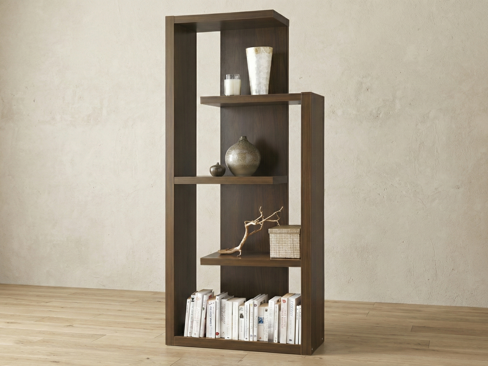 An interior shot featuring a modern, Mahogany Aldgate display unit against a textured plaster wall. The shelves are dressed with neutral accessories and books that complement the warm tones of the light wood flooring