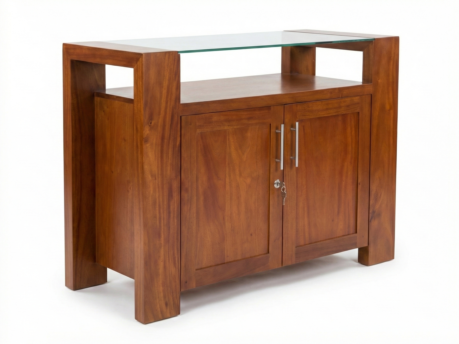 Side view of a rich, reddish-brown solid wood mahogany Exodus-GT Sideboard, featuring a thick rectangular frame. The piece has two lockable doors with a vertical grain pattern and is topped by a clear, tempered glass surface elevated above the main body