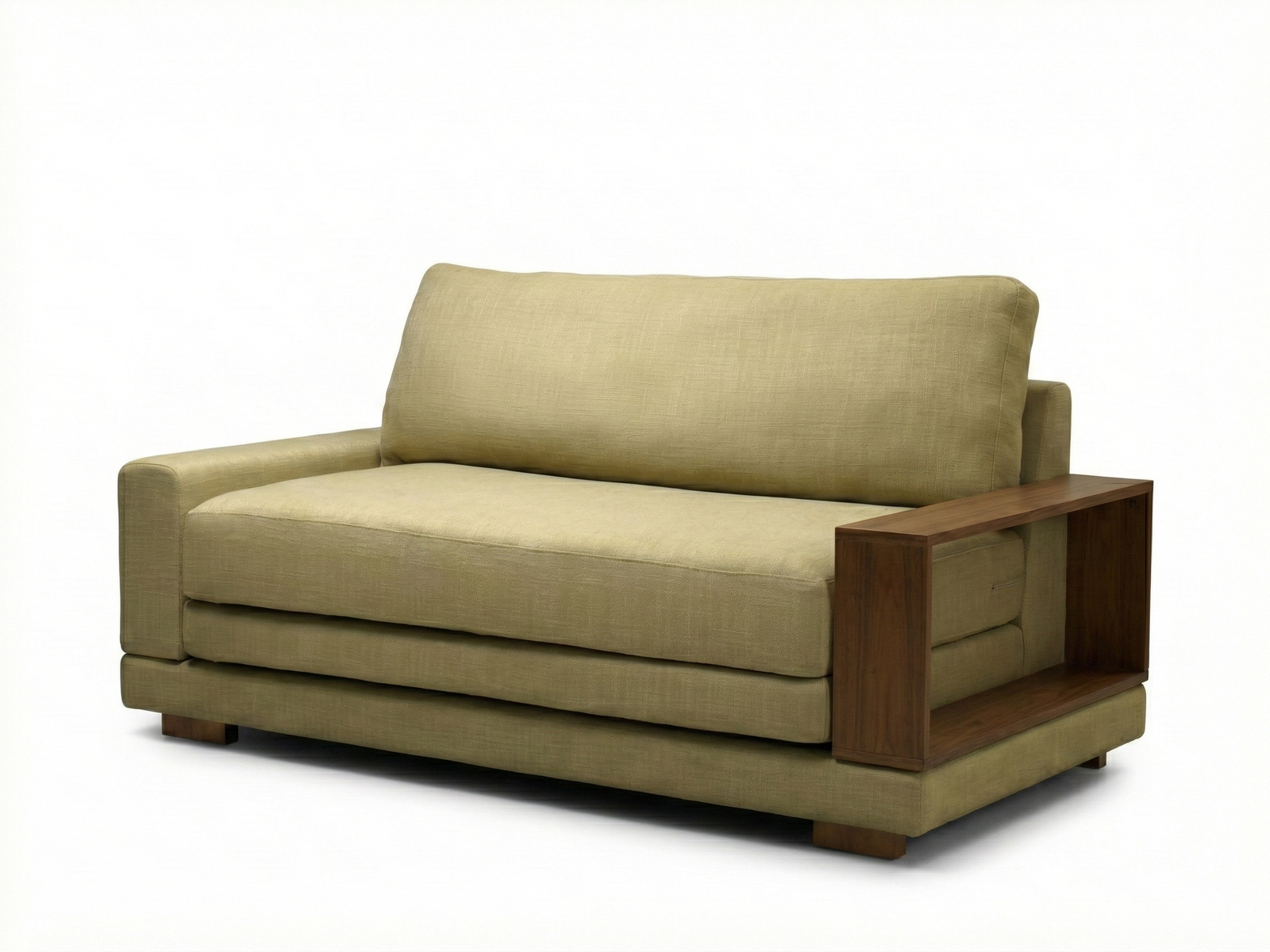 Side view of a modern Sainsbury sofa bed with cream upholstery, isolated on a white background. The sofa has an asymmetrical design, with a thick, fabric-covered armrest on the right and a thin, open, L-shaped dark wood armrest on the left